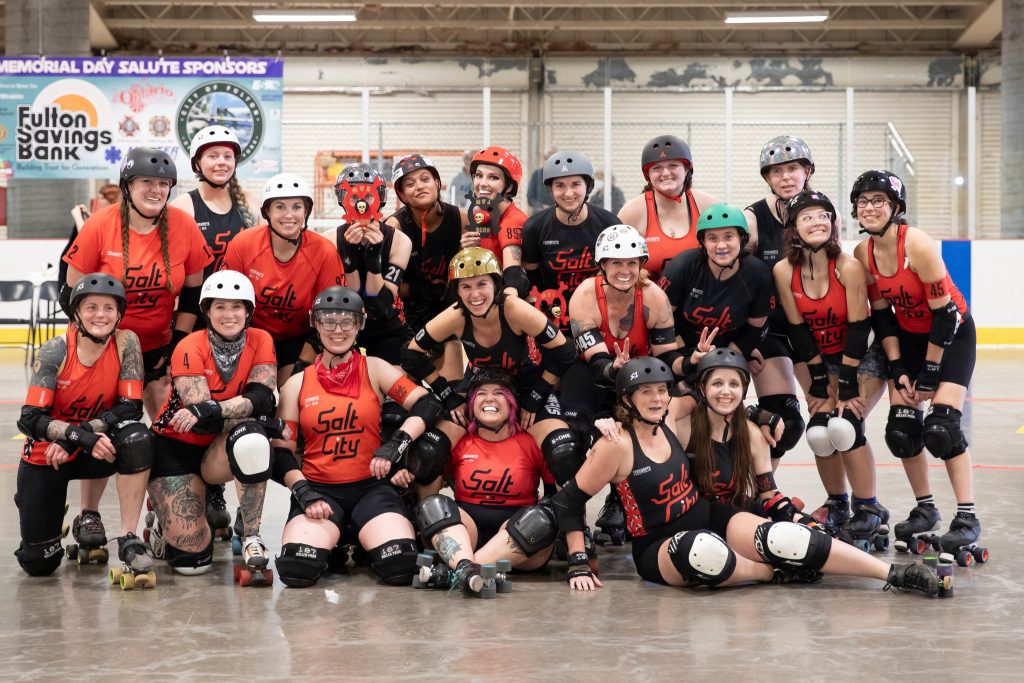 Group photograph of our Home Teams, the Spuds and Riggies decked out in their derby gear after a bout. 